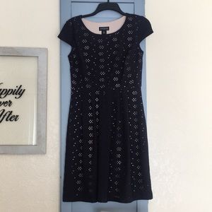 Navy dress with a cream lining.